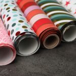 Different,Colorful,Wrapping,Paper,Rolls,On,Grey,Table,,Closeup