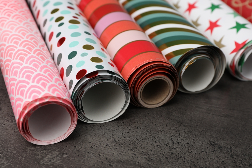 Different,Colorful,Wrapping,Paper,Rolls,On,Grey,Table,,Closeup